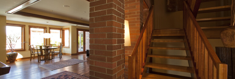 Buckskin Drive Laguna modern Prairie style home wooden stairway & brick detail