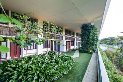 At each alternate level, extensive gardens extend from the loft units, serving as deep communal balconies