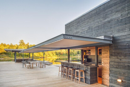 A MODERN BOATHOUSE IN A CANADIAN LANDSCAPE