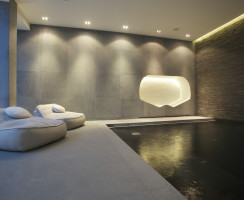 Relaxation area within basement swimming pool