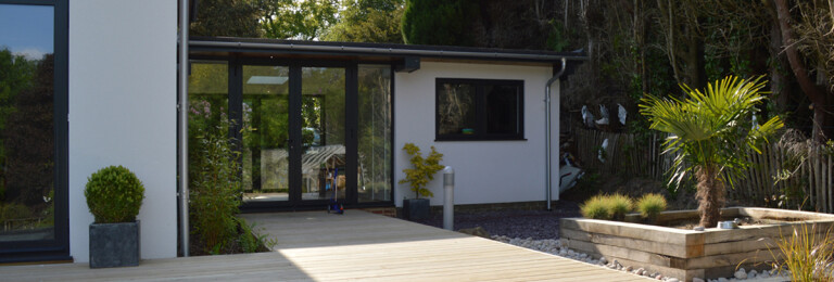 Dual Aspect Entrance viewed from the back garden at a renovated 1960s property in Haslemere, Surrey