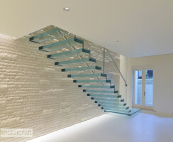 cantilevered glass staircase with glass balustrade