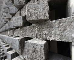 The wall of the recreational complex, made up of rotating bricks