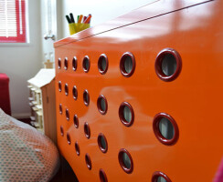 Warehouse style radiator cover in orange