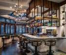 As you make your way past the lobby, you’re met by the gorgeous (and fully stocked) Tredici bar.