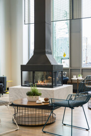 A unique focal point: grab your cappuccino & muffin and slide up to a 360 degree fireplace