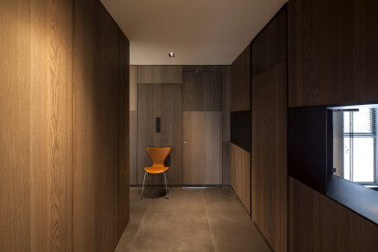 Ombré patchwork timber panels that transition horizontally from light to dark with hidden doors.