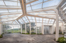 Jeju’s blue sky expands into the pavilion through the glass roof.