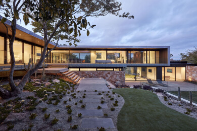 The South Elevation provides complete transparency through the main level to established gardens beyond.