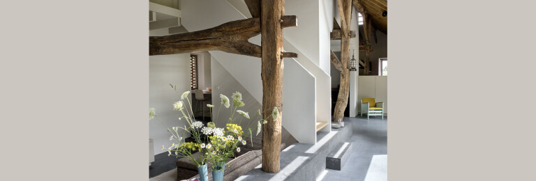 by making a lowered TV room at the spot of the old compost stable, the low-hanging striking fork truss can be retained
