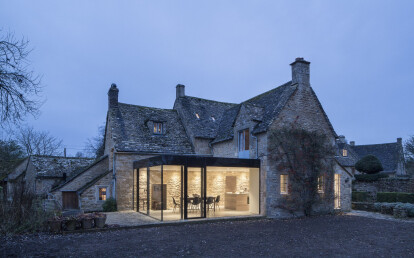 Glass box extension to a Grade II listed cottage.