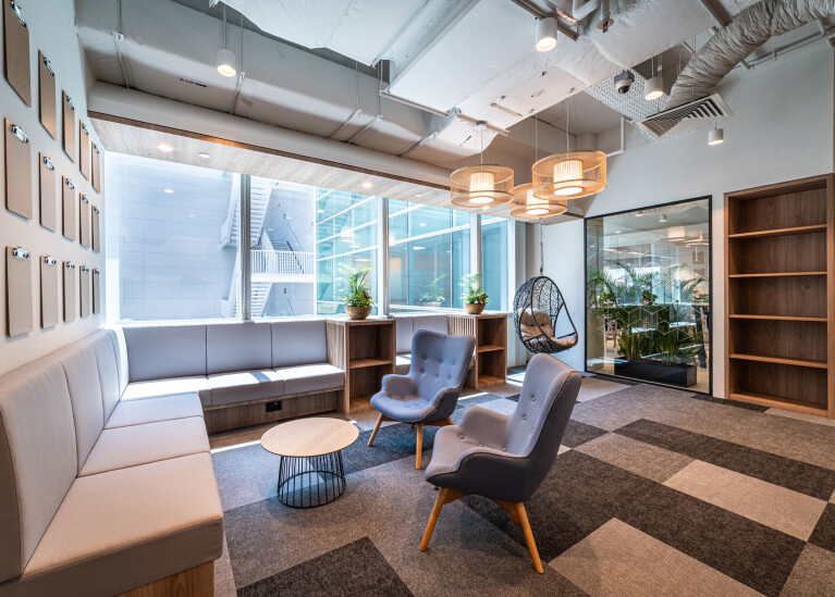 Corporate office interior design consists of a cosy library space, created at Azqore by Space Matrix - 1