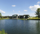 The transparent rear façade of the building offers stunning panoramic views over the reflecting pool and the magnificent re-invigorated natural pond beyond.