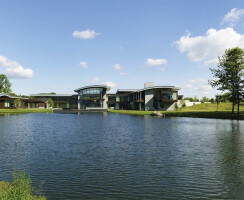 The transparent rear façade of the building offers stunning panoramic views over the reflecting pool and the magnificent re-invigorated natural pond beyond.