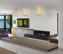 Bidore 140 by Element4: The horizontal overlap of the chunky black mantel and the grey stone make for a beautiful transition between materials and help extend the linear nature of this modern gas fireplace.