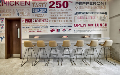 Domino's pizza counter and tables