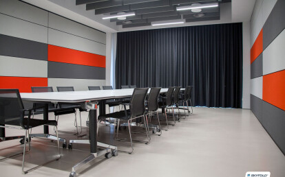 Two Skyfold movable walls sub-dividing an office space to make a flexible meeting room