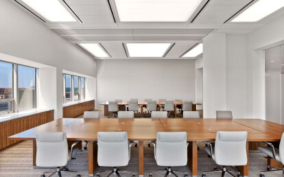 Skyfold movable wall sub-dividing an office boardroom