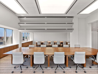 Skyfold Classic movable wall deploying from the ceiling to sub-divide a meeting room