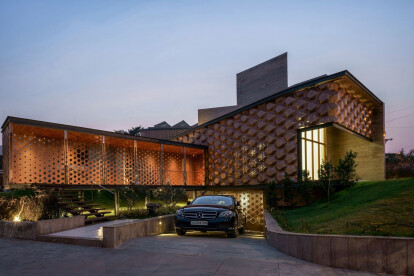 Biomimicry informs the solar sensor-based façade of this intelligent, adaptable family home