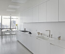 KITCHEN: by Boffi with upper cabinets in aluminum and base cabinet and countertops in Corian; breakfast table: custom design by Giusi Mastro.