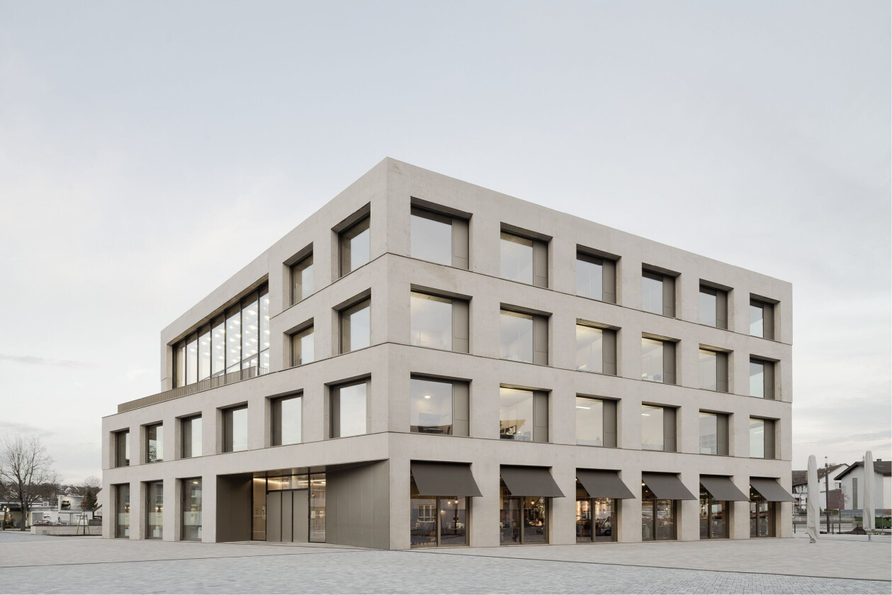 Regularly spaced windows and deep reveals define this discrete new town hall for Remchingen
