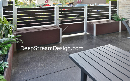 Architectural Anodized Aluminum Screen Wall anchored by integrated Commercial Restaurant Planters, Benches and Gate