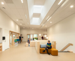 The centre of the building is bathed in natural light through large lanes of light in the roof.