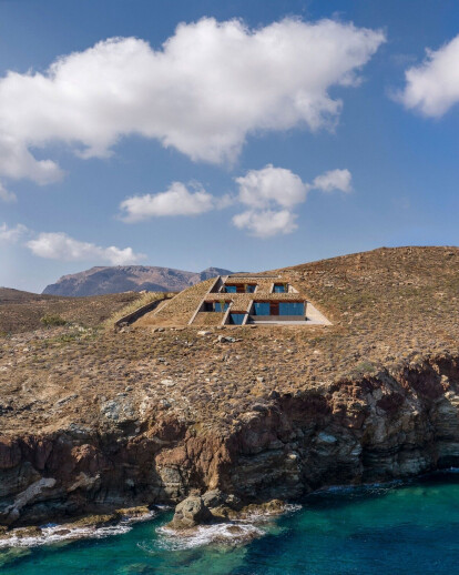 NCAVED house embeds itself into a rocky, windy, island site