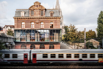 Former railway station in Brussels transformed into a cultural centre complete with floating glazed extension