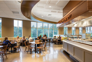 The new dining commons at Mount Holyoke College combines three styles of thermoformed ceiling panels plus mineral fiber panels to create visual scale and flow throught the large hall.