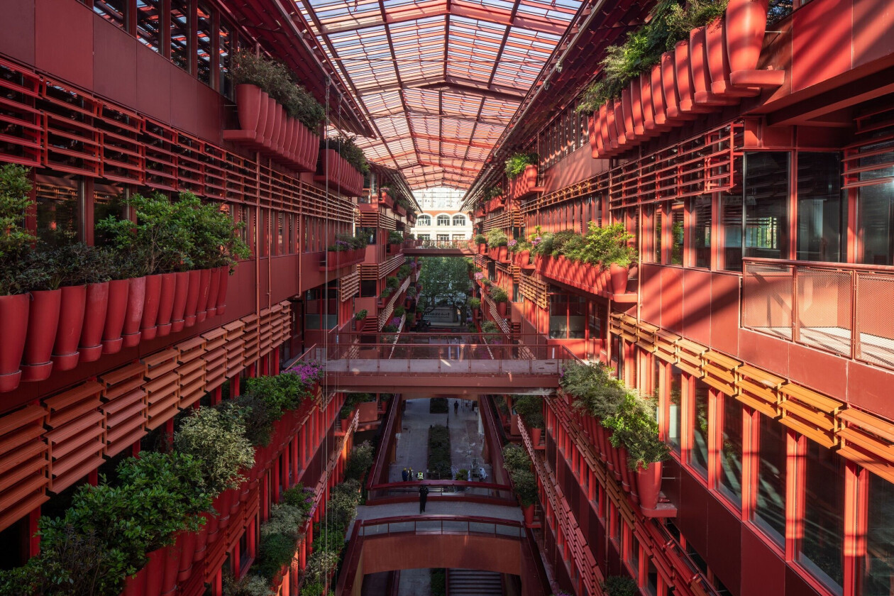 Ateliers Jean Nouvel completes bright red arcade lined with rows of flower pots