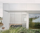 A durable, drought-tolerant native green roof connects the first floor master bedroom with colourful blooms, while also reducing urban heat island effect.