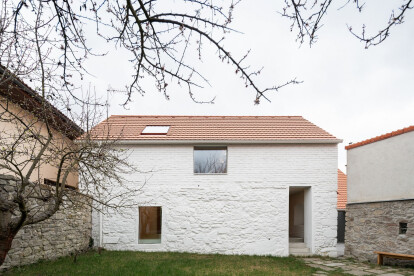 Atelier 111 architekti connects two houses in historical center of Czech village to transform into their family home