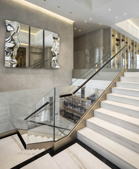 STAIRCASE - in Bianco Lasa marble by Antolini; Parapet Railing Glass by Extravega