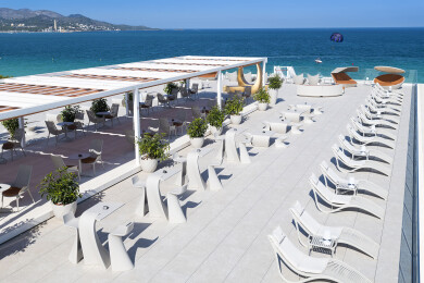 Outdoor contract furniture Ibiza sun loungers, Wing stool and table, and Vases planters by Vondom