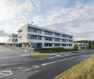 View of the school. The nursery wing visible in the background is adjacent to the woodland.