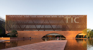 TIC Art Center by DOMANI Architectural Concepts showcases a mesh-like building façade set in a dramatic landscape
