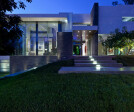 Summit House Beverly Hills luxury modern mansion with glass wall exterior & front entrance