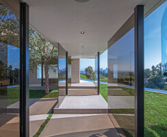 Laurel Way Beverly Hills luxury home modern glass wall walkway