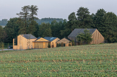 BXB studio spreads Farmhouse program over five barns with each their own function and distinct wood texture