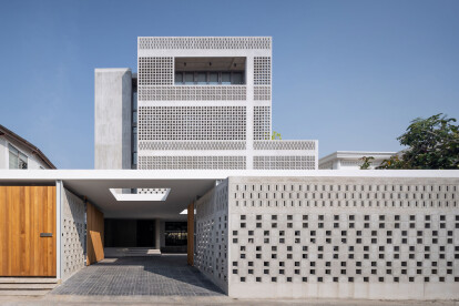 Sailom house uses perforations to achieve environmental comfort while adding a new dimension to the architecture