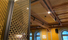 Banker Wire M22-83 Brass wire mesh installed as ceiling tile and TXZ-3 Braided Brass wire mesh installed as wall decor for Beirut Café in Stockholm Sweden
