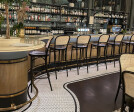 S-32 brass mesh is featured as a front cladding for their bar counter