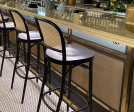 S-32 brass mesh is featured as a front cladding for their bar counter