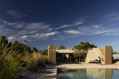 Bica Arquitectos wraps a house in Fir Wood Palisade to preserve the dunes in Troia