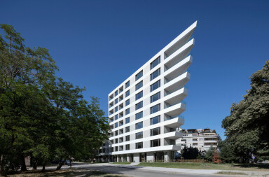 Angular balconies and scenic views of the Black Sea dictate this mixed-use residential block by Starh