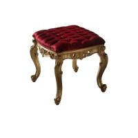 Red upholstered ottoman with baroque antiqued gold base