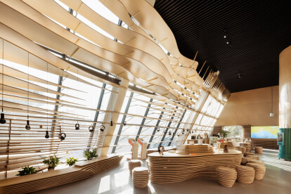 Parallect Design layers curves and flowing wooden notes to create this audio bookstore in Suzhou