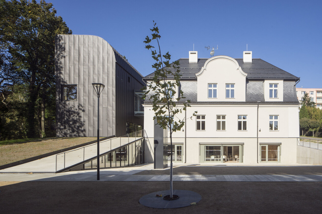 IGI Library by atakarchitekti forms a new piazzetta between an existing building and a dynamic new extension